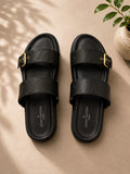 Louis Vuitton Bom Dia Flat Mule in black monogram embossed leather with gold buckles
