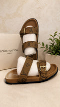 Louis Vuitton Bom Dia Flat Mule in brown monogram canvas with gold buckle hardware