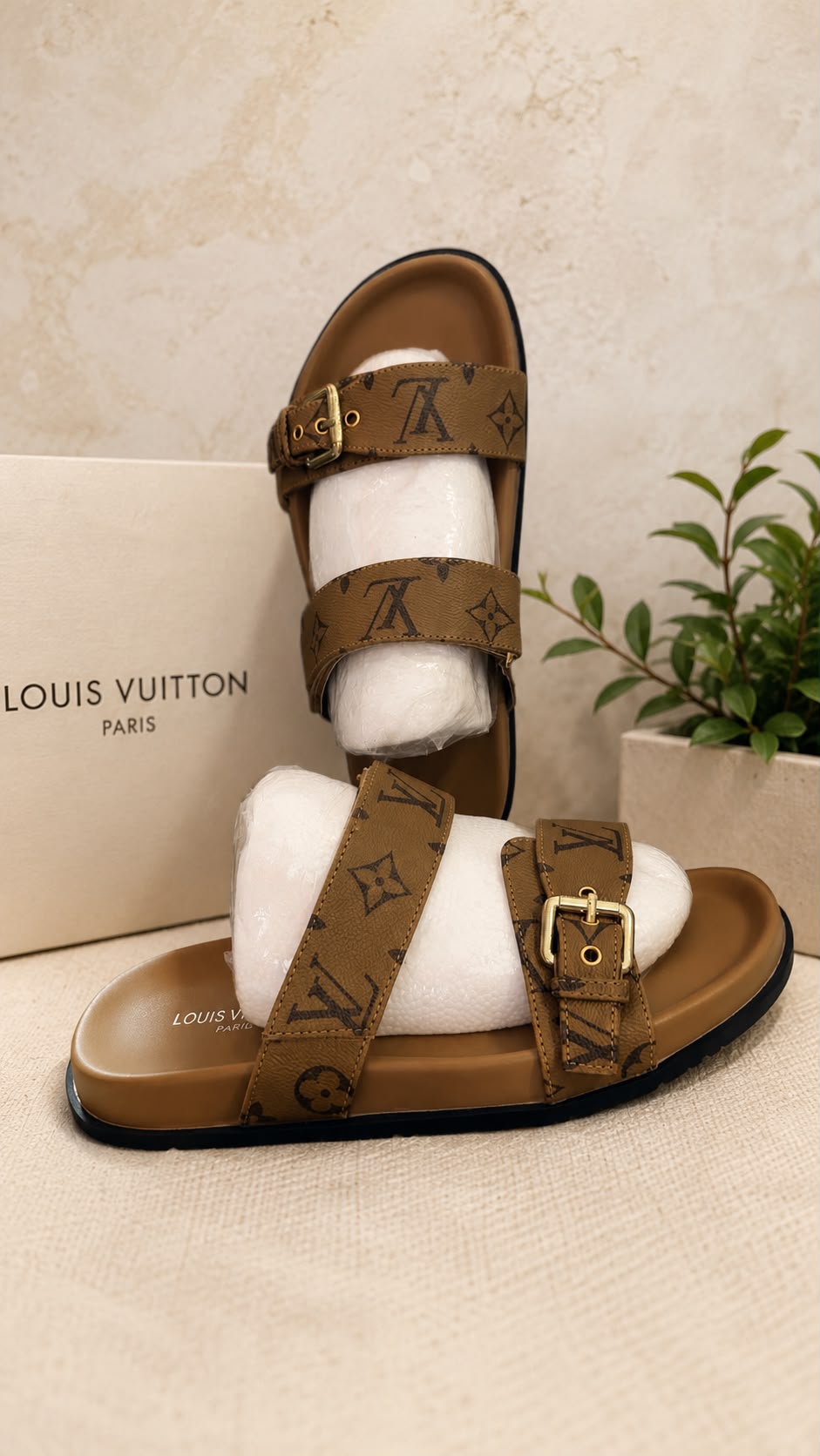 Louis Vuitton Bom Dia Flat Mule in brown monogram canvas with gold buckle hardware