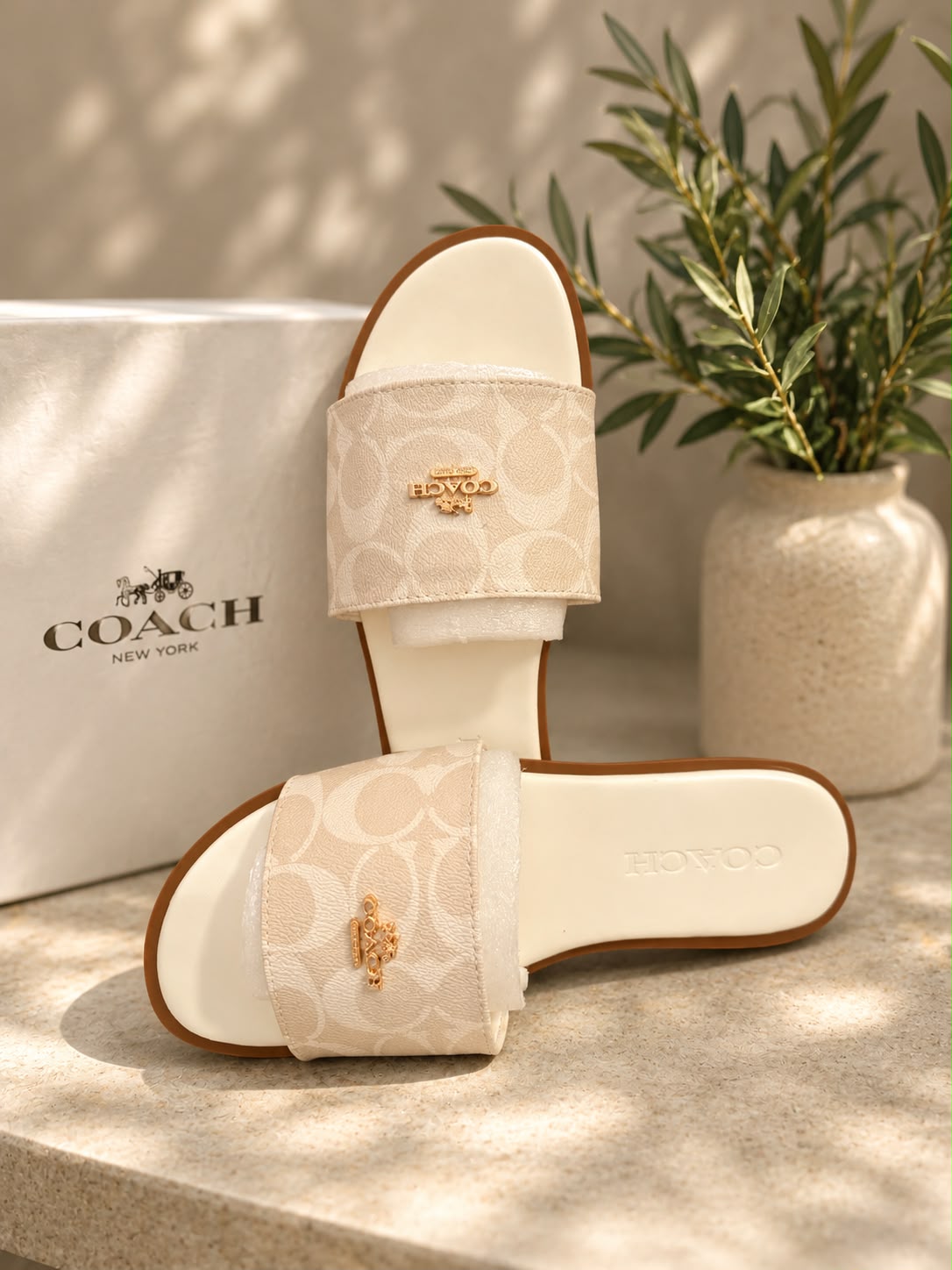 Coach signature canvas slide sandal in cream ivory with gold charm