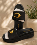 Coach platform slide sandal in black signature canvas with oversized gold C hardware
