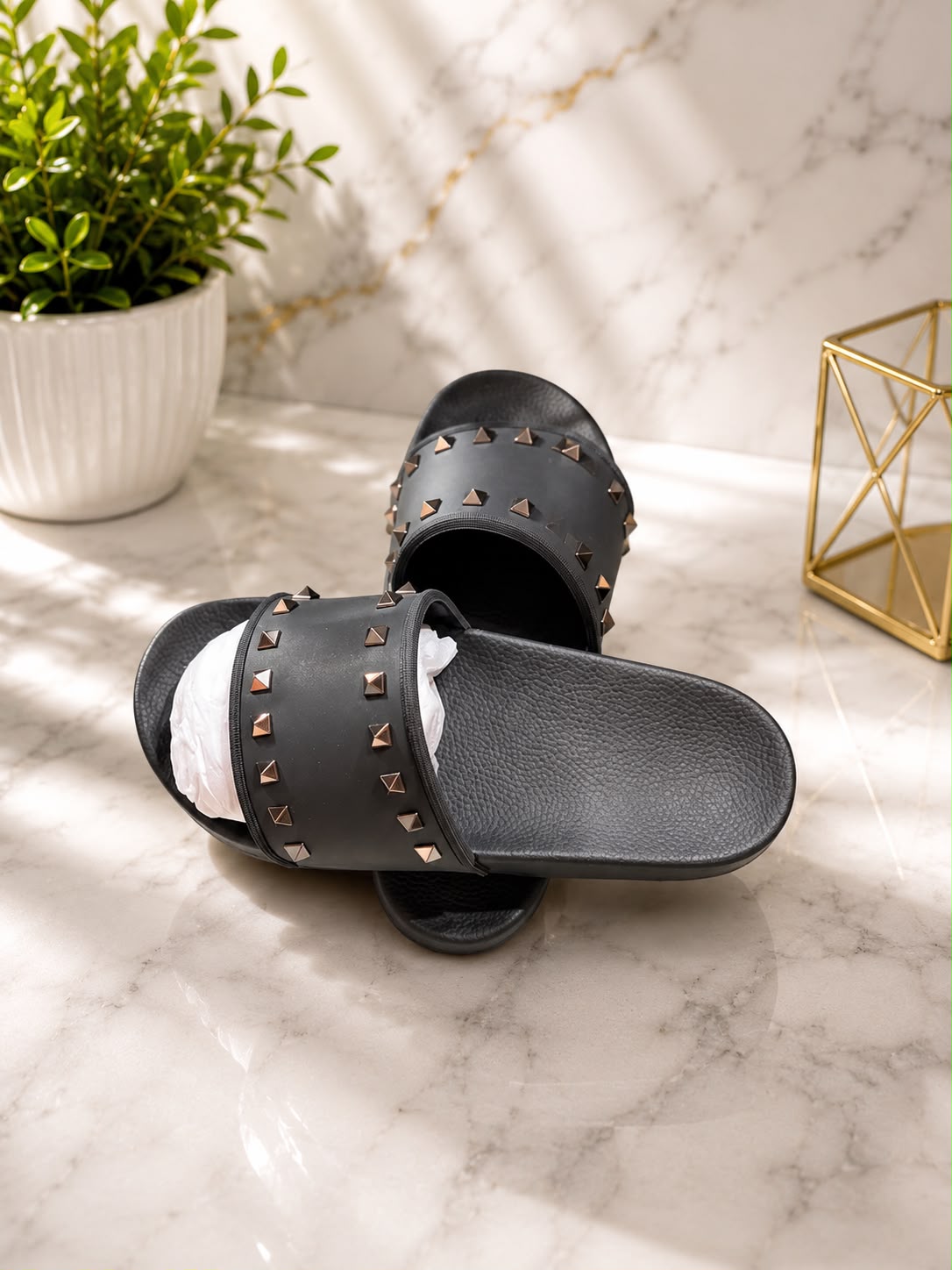Valentino Rockstud Slide in black leather with gunmetal pyramid stud hardware